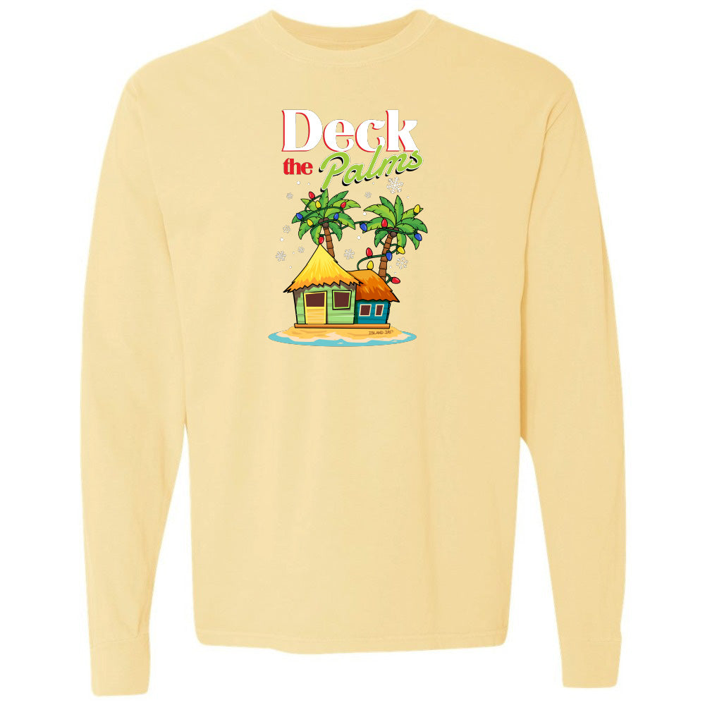 Yellow long-sleeve shirt with a tropical hut and palm tree design and graphic text reading "Deck The Palms" on a white background