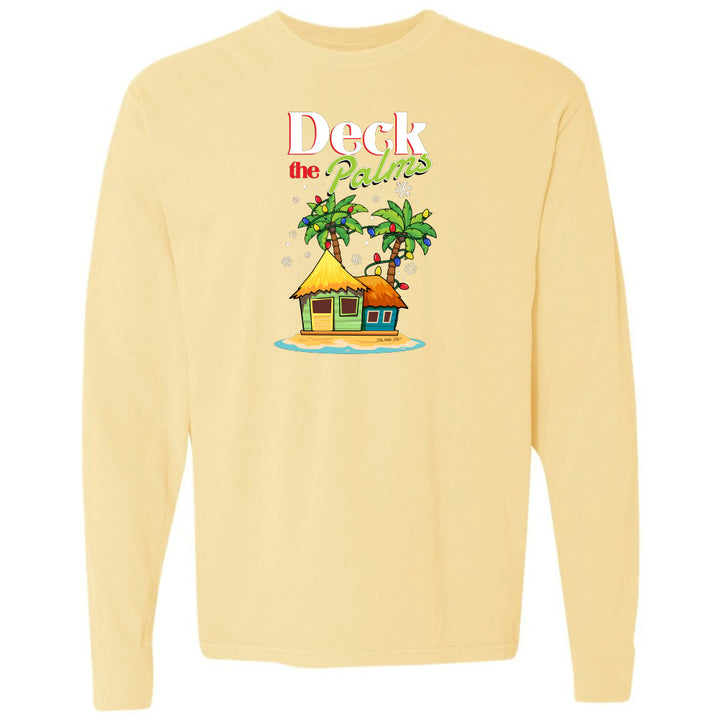 Yellow long-sleeve shirt with a tropical hut and palm tree design and graphic text reading "Deck The Palms" on a white background