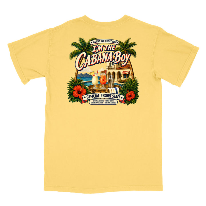 A pale yellow short-sleeve t-shirt with a large, colorful retro graphic on the back. The graphic features palm trees, red hibiscus flowers, a beach bar scene, and the text 'I'm The Cabana Boy' and 'Official Resort Staff'.
