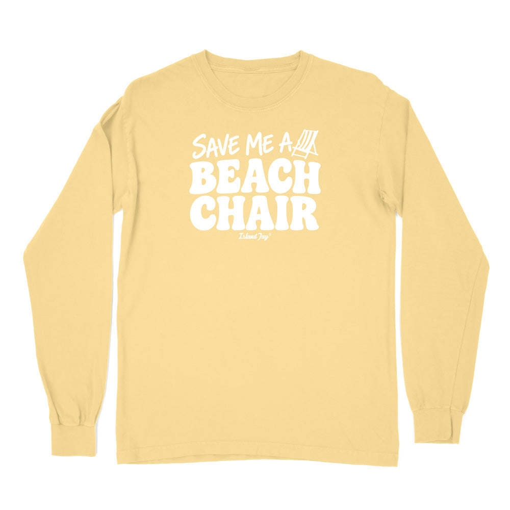 A pale yellow long-sleeve t-shirt with a white graphic print on the chest reading 'SAVE ME A BEACH CHAIR' 