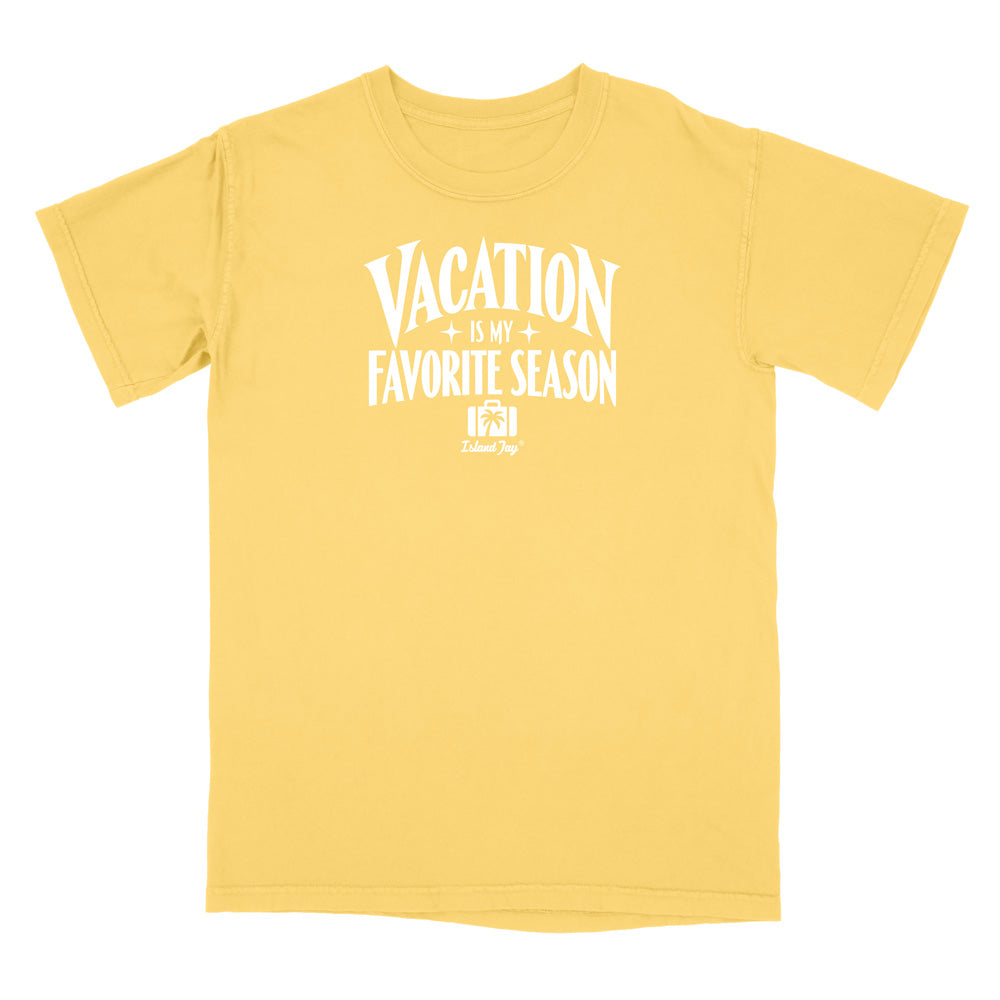 A yellow short-sleeve crewneck t-shirt with a white graphic print on the front that reads 'VACATION IS MY FAVORITE SEASON' with a small 'DelmarSys' logo underneath, displayed on a solid white background.