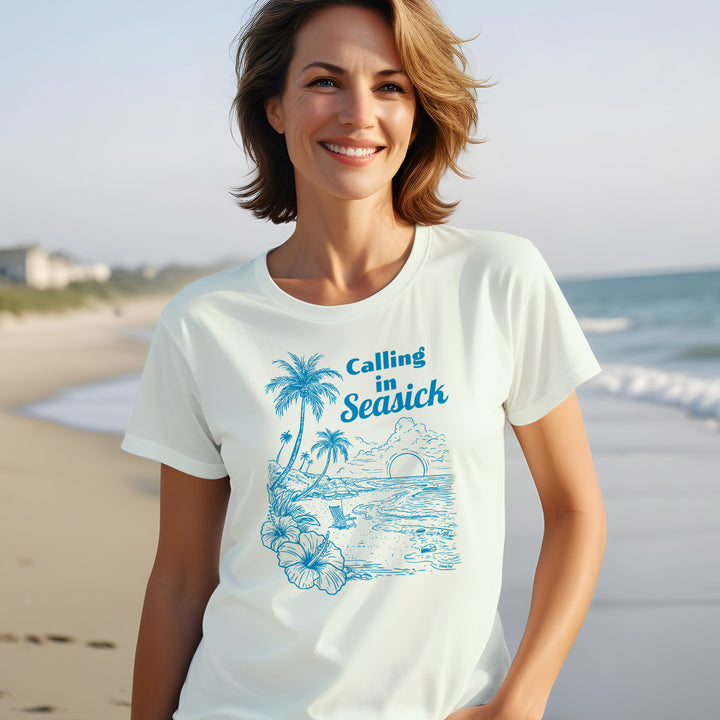 Calling In Seasick Funny Womens Tee. Shows a women wearing a soft and comfortable beach tee with calling in sick on it. THe shirt shows a beautiful beach scene.  Color Honeydew