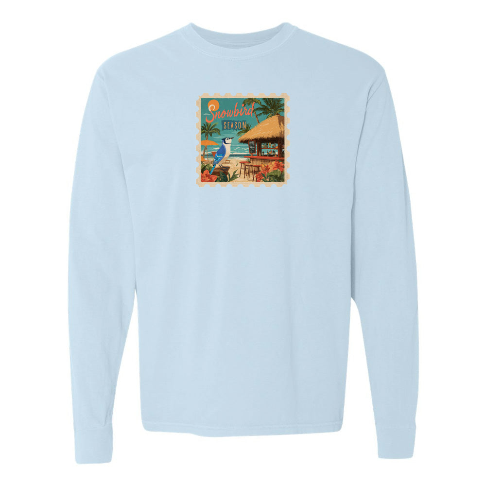 Light blue sweatshirt with a colorful graphic on the chest against a white background