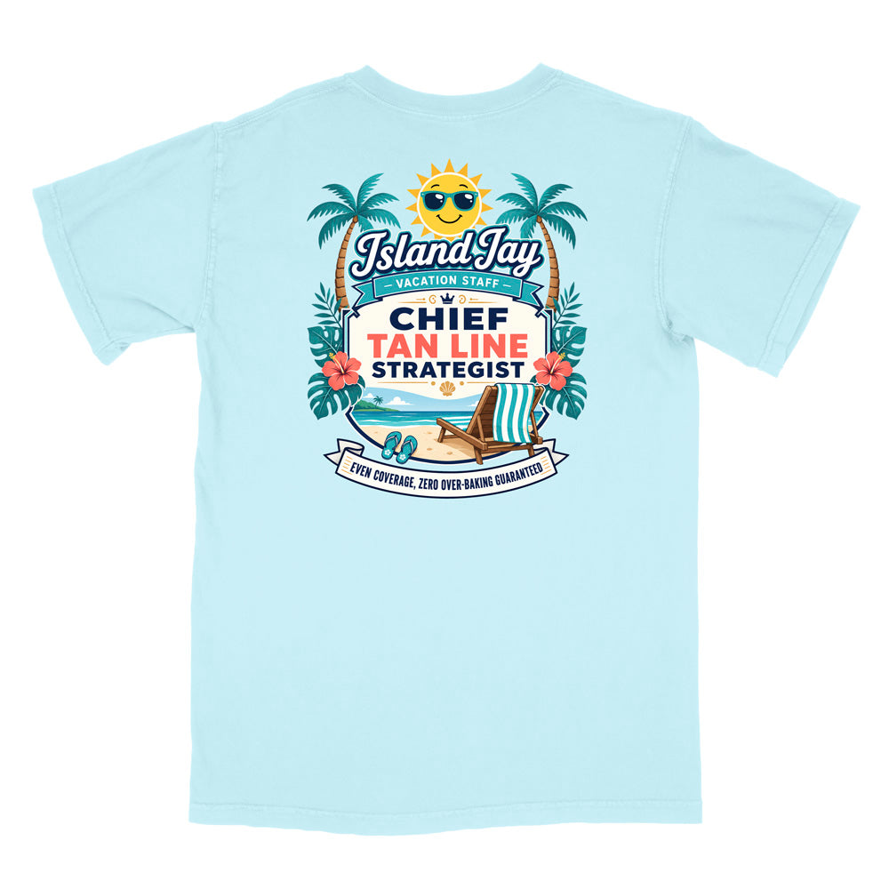 A light blue short-sleeve t-shirt with a colorful graphic print on the front. The graphic features a smiling sun wearing sunglasses, palm trees, a beach scene, and text that reads 'Island Jay Vacation Staff by CHIEF TAN LINE STRATEGIST'.