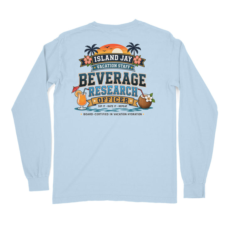 A light blue long-sleeve t-shirt shown from the back, featuring a colorful graphic print with palm trees, an orange sunset, and text that reads 'ISLAND JAY BEVERAGE RESEARCH OFFICER'.