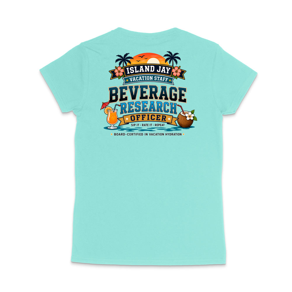 A light aqua short-sleeve t-shirt shown from the back, featuring a colorful graphic print with tropical elements and the text 'ISLAND JAY BEVERAGE RESEARCH OFFICER'.