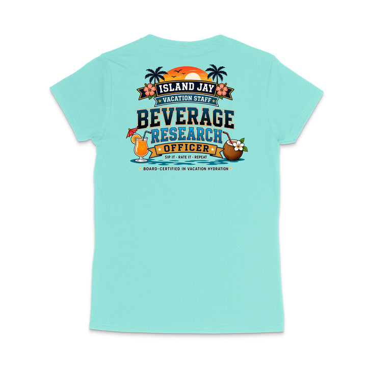 A light aqua short-sleeve t-shirt shown from the back, featuring a colorful graphic print with tropical elements and the text 'ISLAND JAY BEVERAGE RESEARCH OFFICER'.