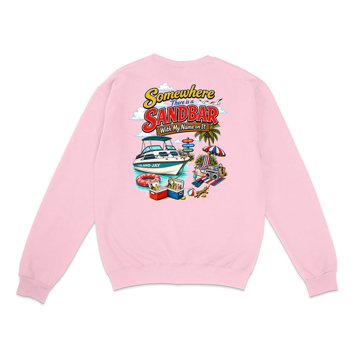 A light pink crewneck sweatshirt shown from the back, featuring a colorful graphic print with the text 'Somewhere There is a SANDBAR' and a beach boat party illustration.