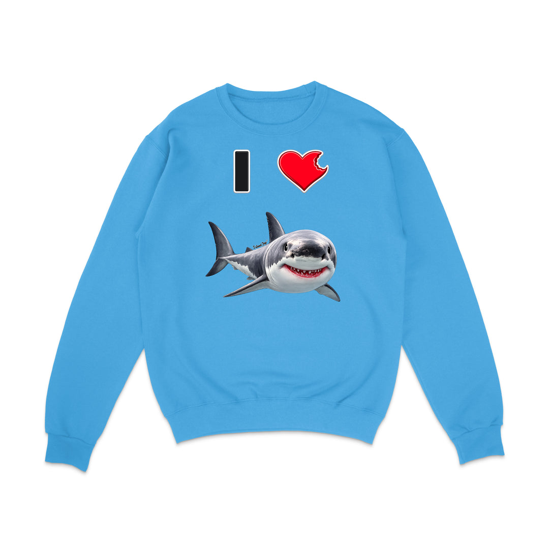 A light blue crewneck sweatshirt featuring a graphic print of a great white shark and the text 'I' followed by a red heart, displayed on a clean white background.