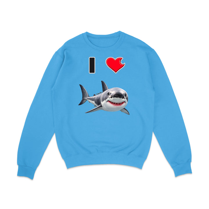 A light blue crewneck sweatshirt featuring a graphic print of a great white shark and the text 'I' followed by a red heart, displayed on a clean white background.