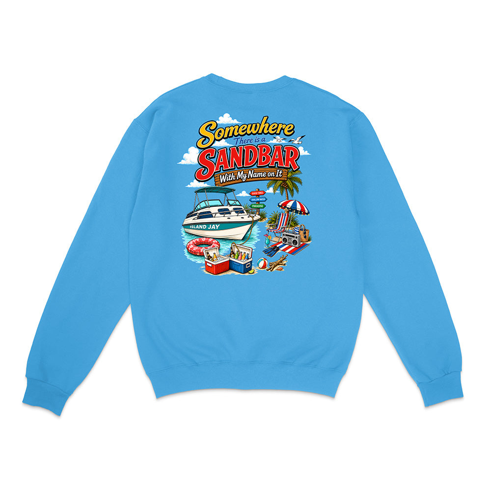 A light blue crewneck sweatshirt shown from the back, featuring a colorful graphic print with the text 'Somewhere in Sandbar With My Name on It' and a beach scene illustration.