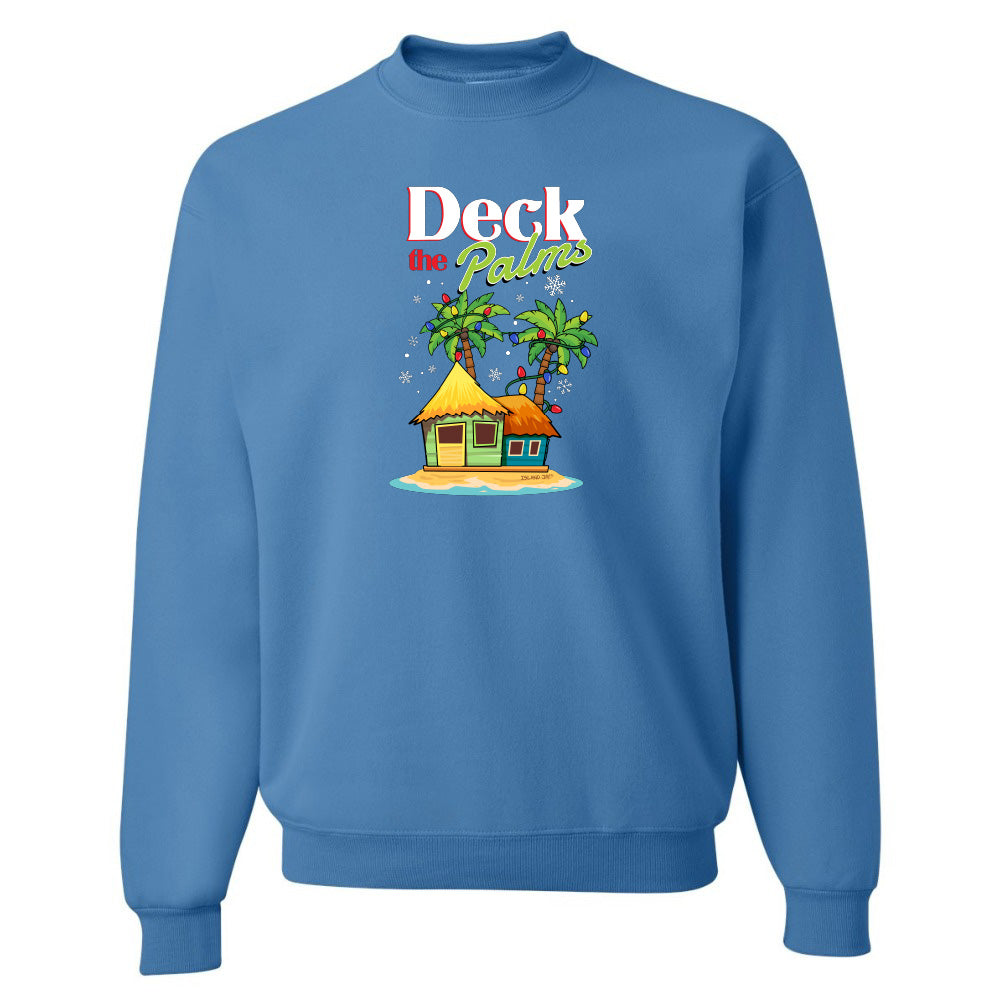 Blue sweatshirt with a tropical hut and palm tree design and graphic text reading "Deck The Palms" on a white background
