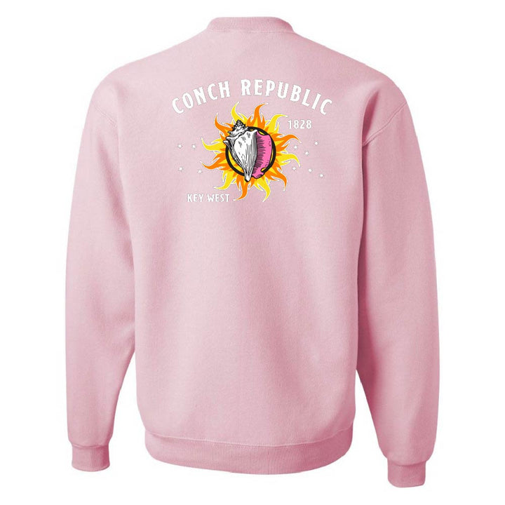 Pink sweatshirt with a graphic design on the back against a white background