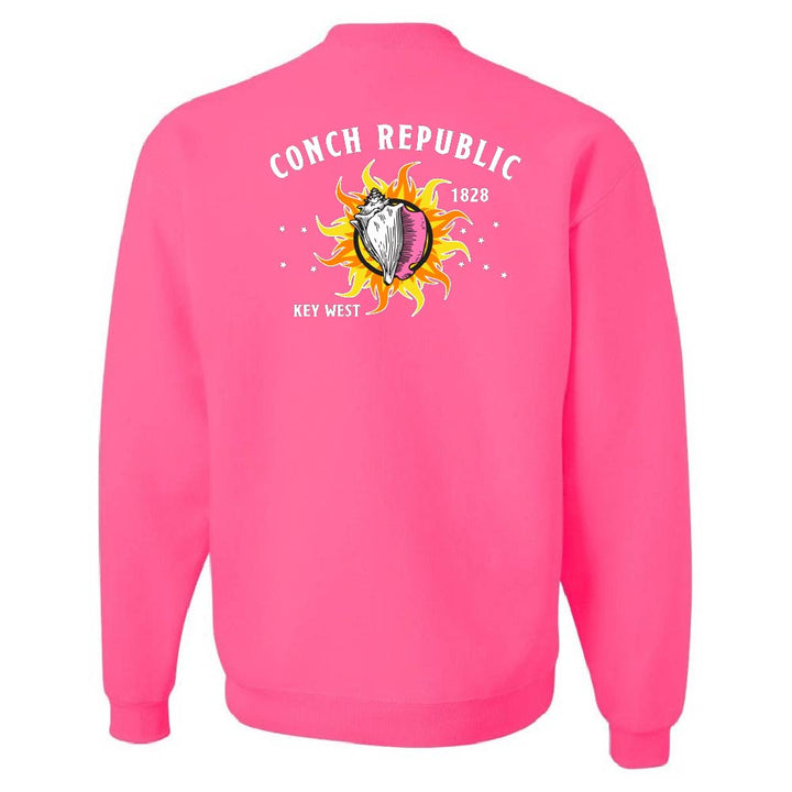 Pink sweatshirt with 'Conch Republic 1828 Key West' design on the back against a white background