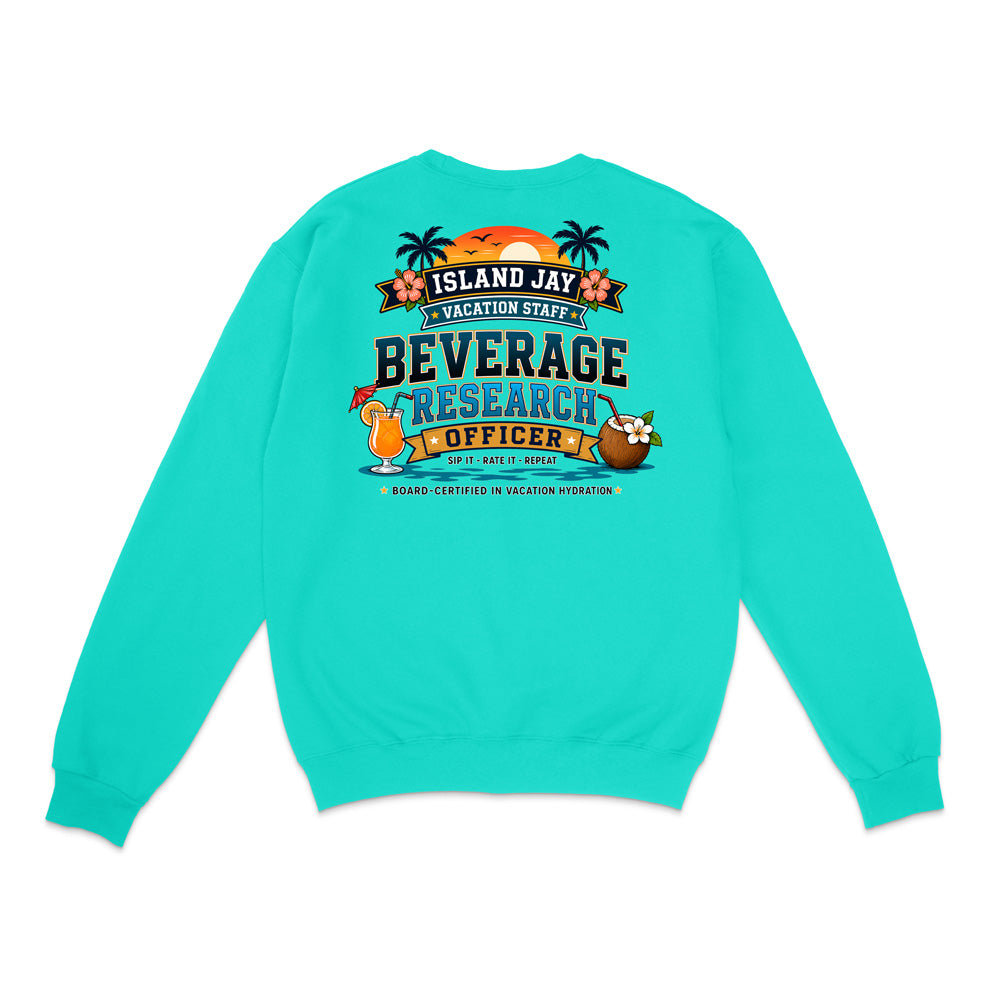 A turquoise crewneck sweatshirt shown from the back, featuring a colorful graphic print with tropical elements and the text 'ISLAND JAY BEVERAGE RESEARCH OFFICER'.