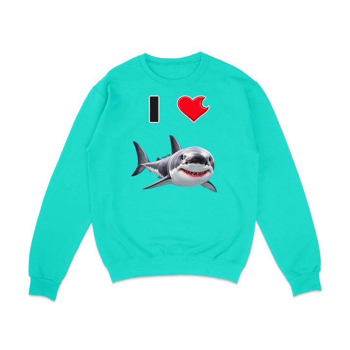 A turquoise crewneck sweatshirt featuring a graphic print of a great white shark and the text 'I' followed by a red heart, displayed on a clean white background.