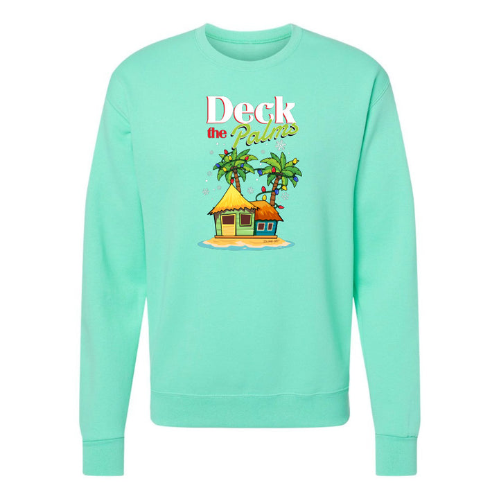 Mint Green sweatshirt with a tropical hut and palm tree design and graphic text reading "Deck The Palms" on a white background