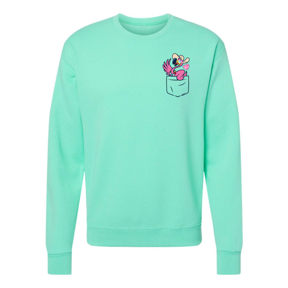 Mint green sweatshirt with a graphic of a pocket and cartoon character on a white background