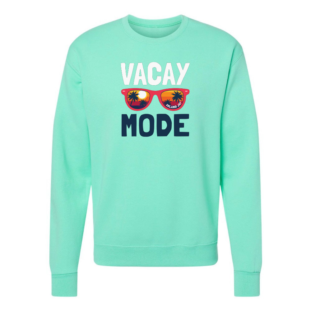 Mint green sweatshirt with 'Vacay Mode' text and sunglasses graphic on a white background