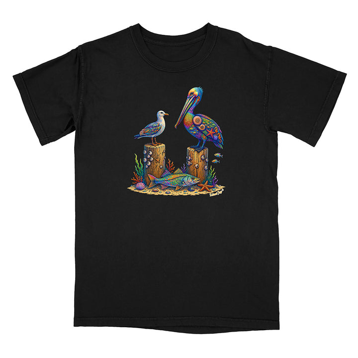 Black t-shirt with a colorful design of a pelican, seagull, and fish on a white background