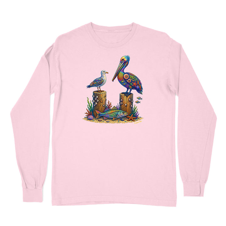 Pink long-sleeve shirt with a colorful pelican design on a white background
