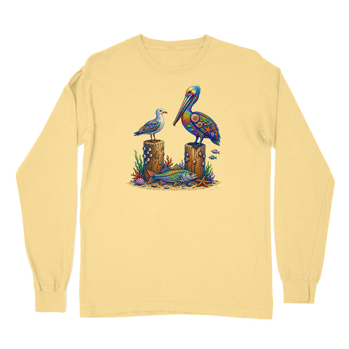 Yellow long-sleeve shirt with a colorful graphic of a pelican and seagull on a white background