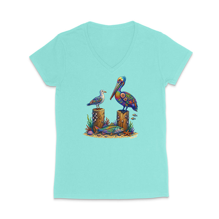 Mint green t-shirt with a colorful pelican and seagull design on a white background