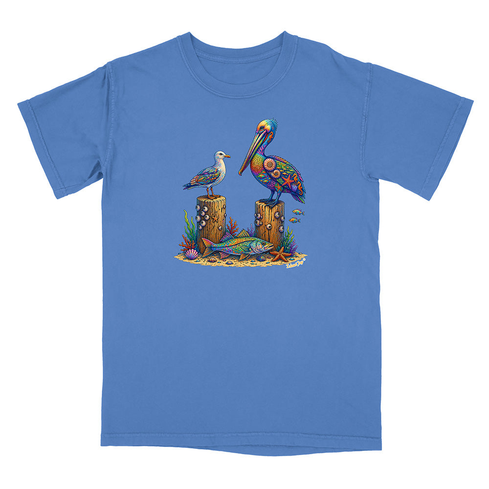 Blue t-shirt with a colorful graphic of two birds on logs and marine life.