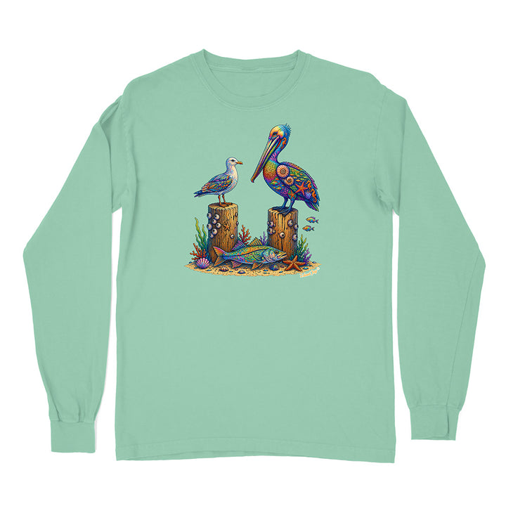 Mint green long-sleeve shirt with a colorful pelican design on a white background