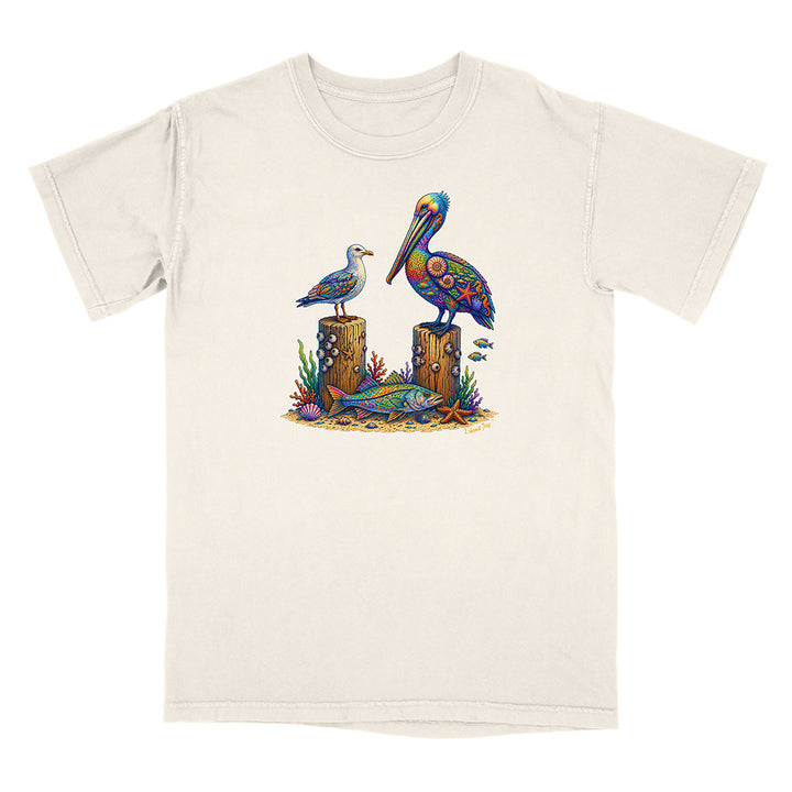 Beige t-shirt with a colorful pelican design on a white background