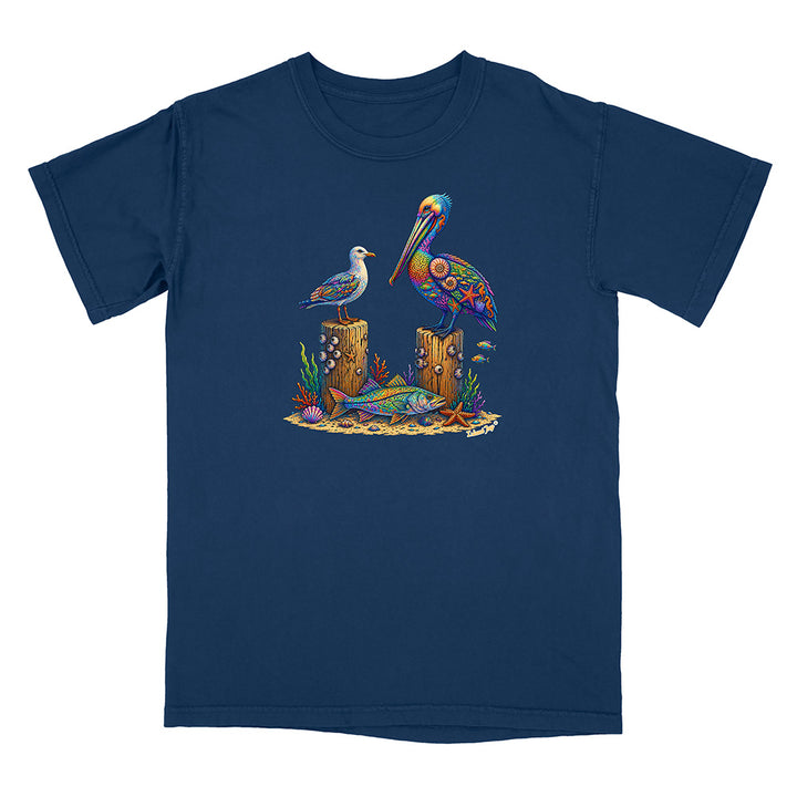 Navy blue t-shirt with a colorful pelican and fish design on a white background