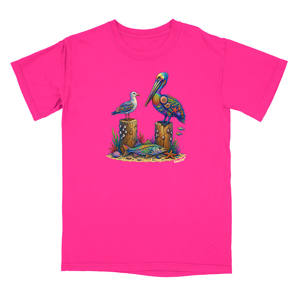 Pink t-shirt with a colorful pelican design on a white background