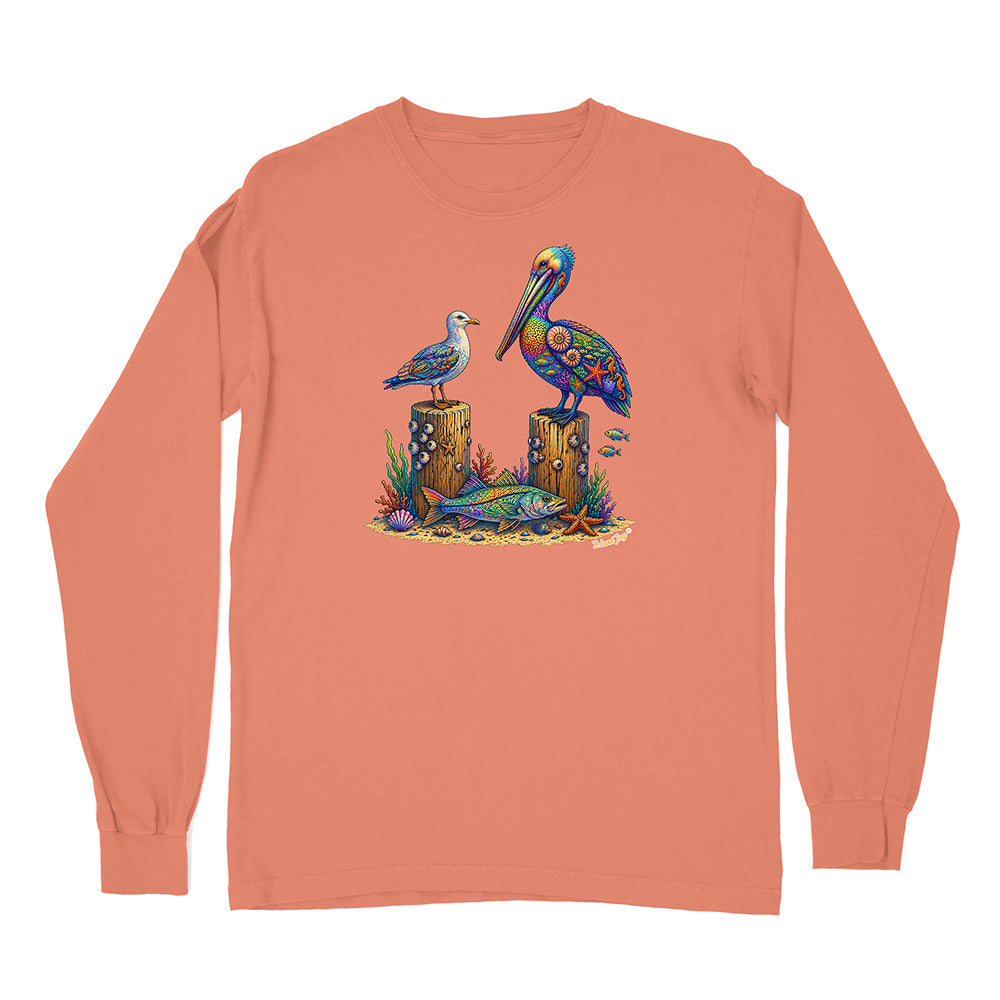 Peach long-sleeve shirt with a colorful pelican design on a white background