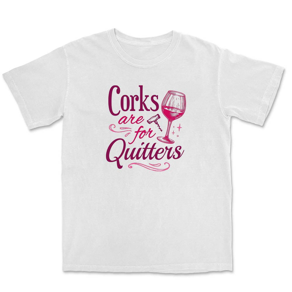 White t-shirt with pink text reading "Corks are for Quitters" and wine glass graphic.