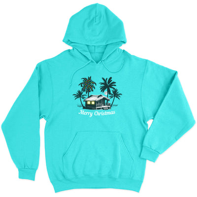 Deck the Palms: All Is CalmHoodie. Featuring a nighttime design of a beach house by the ocean with palm trees. One of the palm trees has christmas lights on it. 