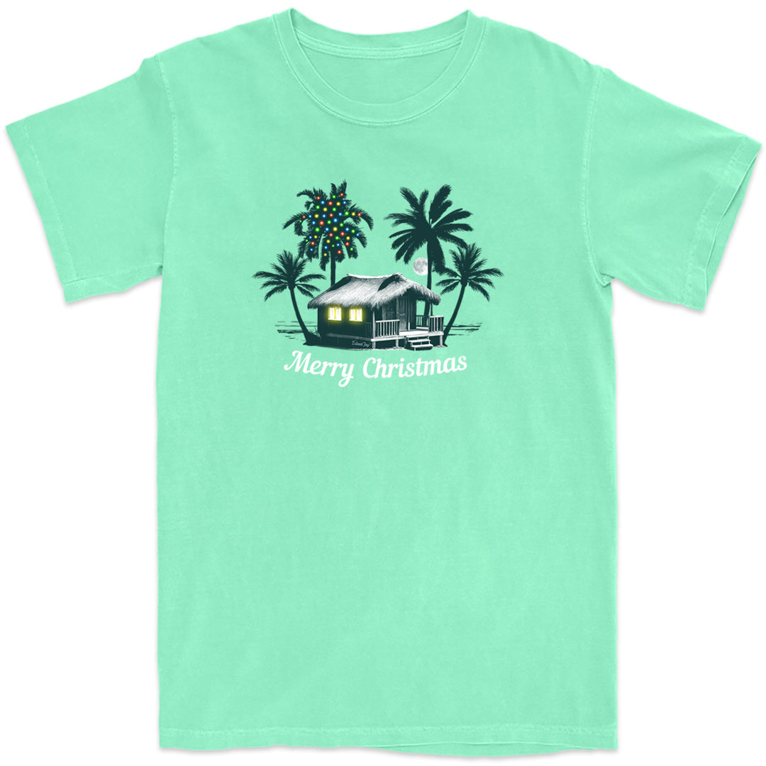 Deck the Palms: All Is Calm T-Shirt. Featuring a nighttime design of a beach house by the ocean with palm trees. One of the palm trees has christmas lights on it. In Island Reef Green Color