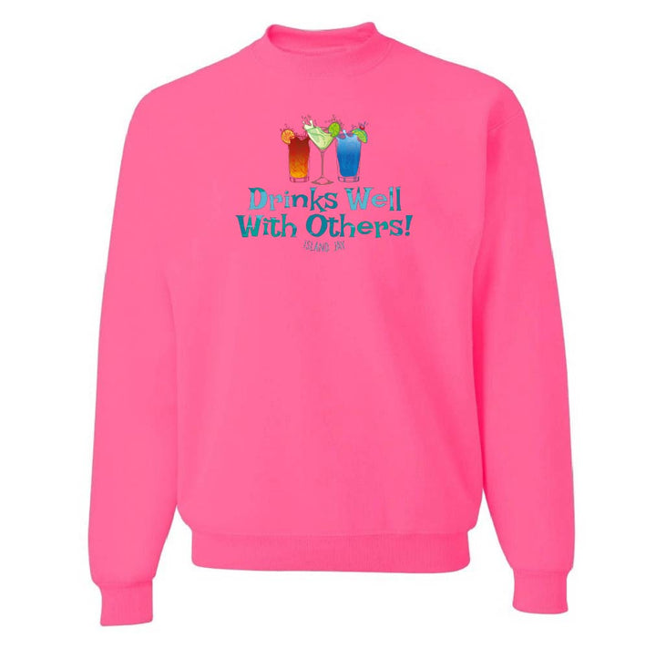 Pink sweatshirt with 'Drinks Well With Others!' text and graphics on a white background