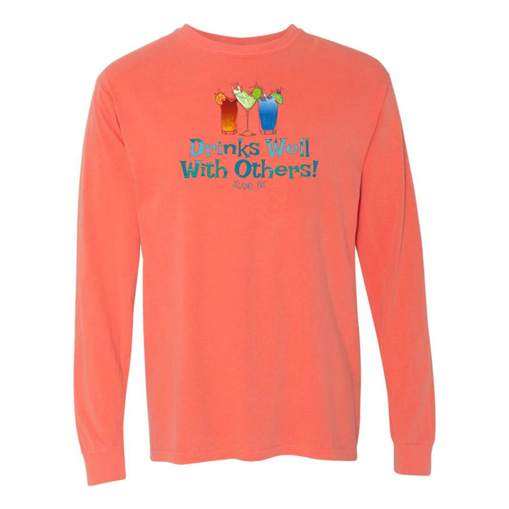 Orange long sleeve T-shirt with mixed drinks graphic and text reading "Drinks Well With Others!"