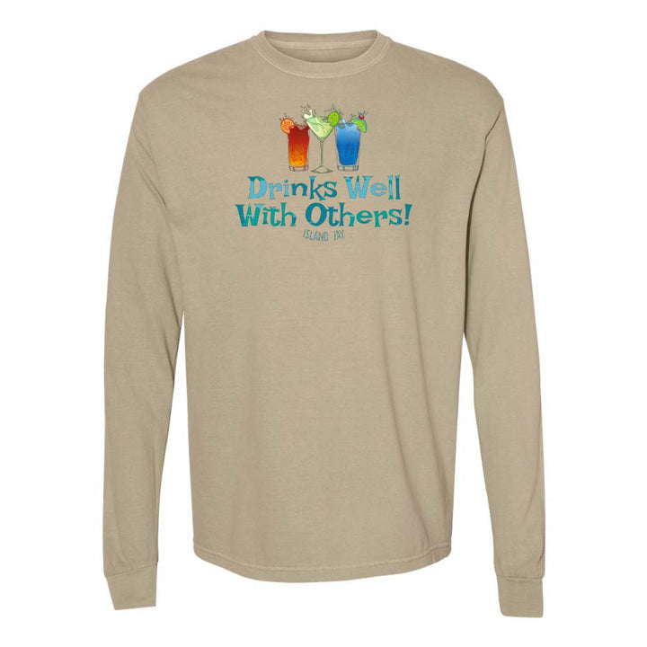 Khaki long sleeve T-shirt with mixed drinks graphic and text reading "Drinks Well With Others!"