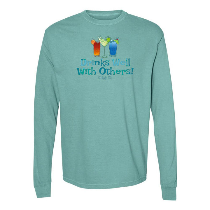Teal long sleeve T-shirt with mixed drinks graphic and text reading "Drinks Well With Others!"
