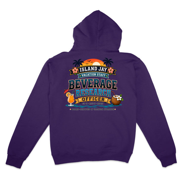A purple pullover hoodie shown from the back, featuring a colorful graphic print that reads 'ISLAND JAY VACATION STAFF BEVERAGE RESEARCHER OFFICER' with tropical illustrations including a coconut, drink, and palm trees.