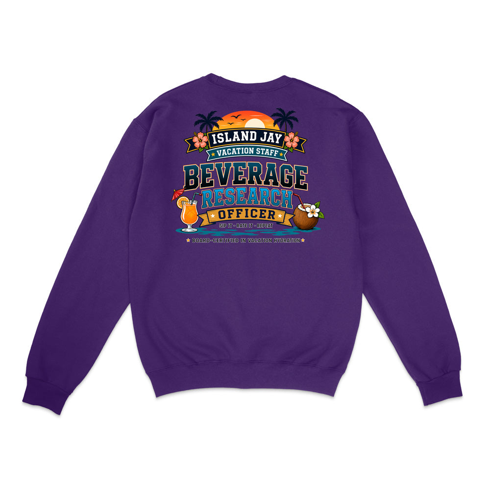 A purple crewneck sweatshirt shown from the back, featuring a colorful graphic print with tropical island elements and the text 'ISLAND JAY VACATION STAFF BEVERAGE RESEARCH OFFICER'.