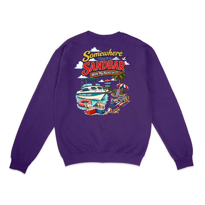 A purple crewneck sweatshirt shown from the back, featuring a colorful graphic print with the text 'Somewhere in Sandbar With My Mums on It' and illustrations of a yacht, beach umbrella, and pool.