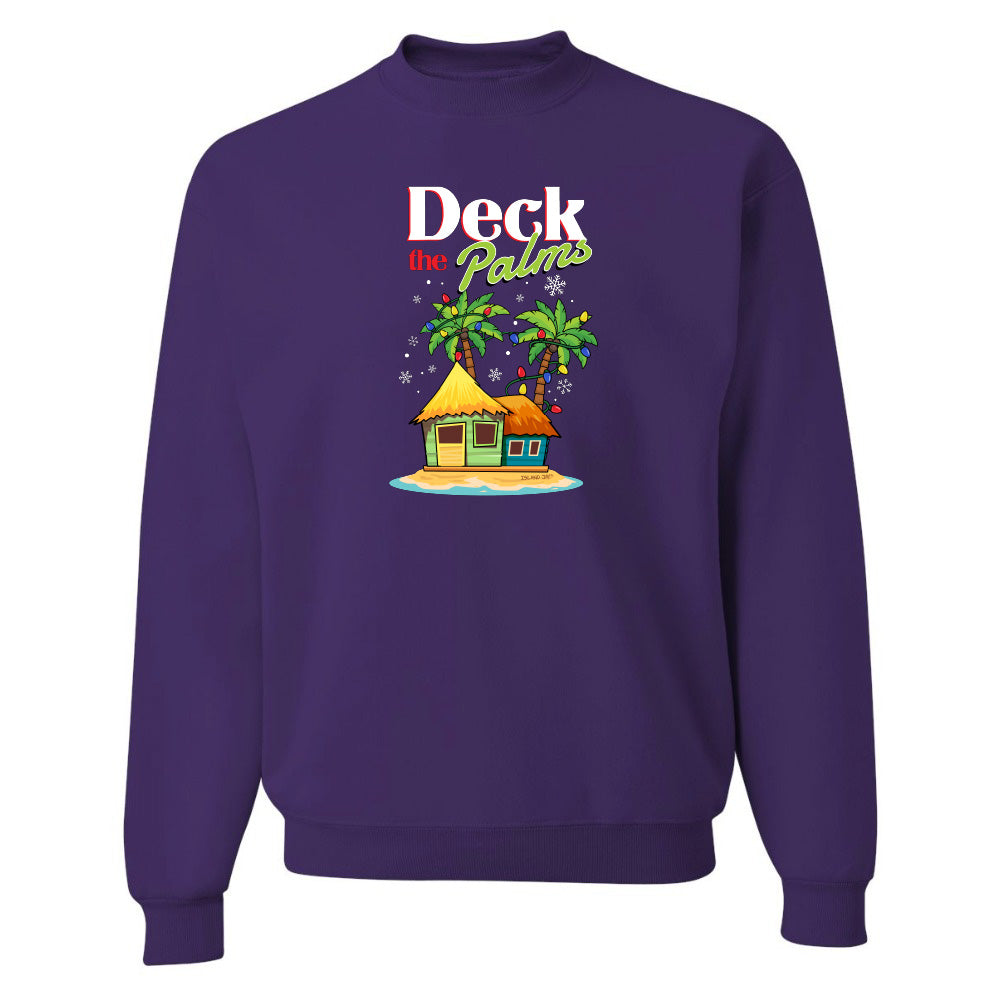 Purple sweatshirt with a tropical hut and palm tree design and graphic text reading "Deck The Palms" on a white background