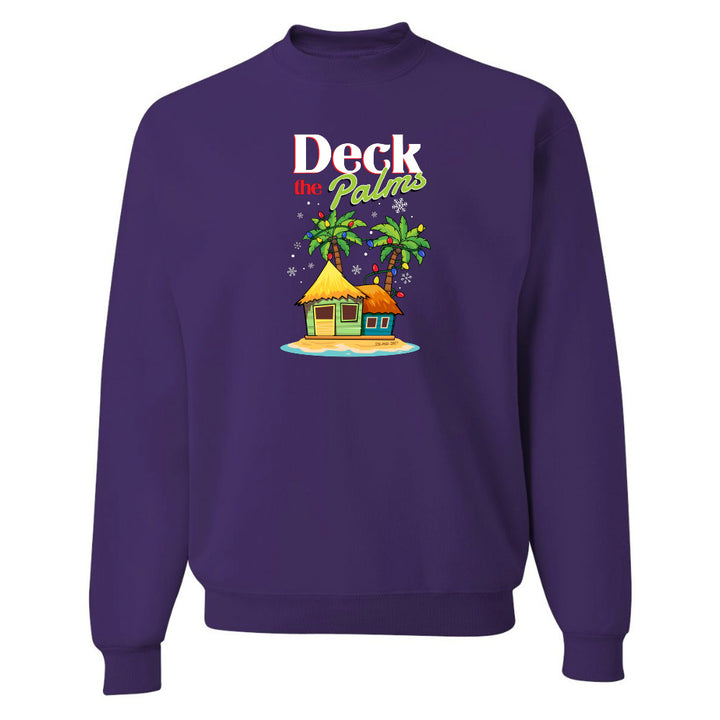 Purple sweatshirt with a tropical hut and palm tree design and graphic text reading "Deck The Palms" on a white background