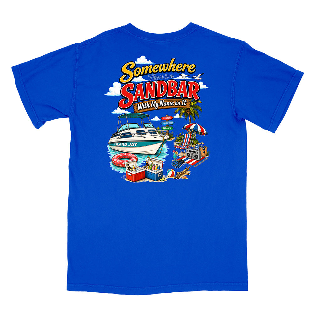 A royal blue short-sleeve t-shirt shown flat against a white background, featuring a colorful graphic print on the back with the text 'Somewhere SANDBAR With My Name on It' and illustrations of a boat, beach umbrella, and poolside scene.