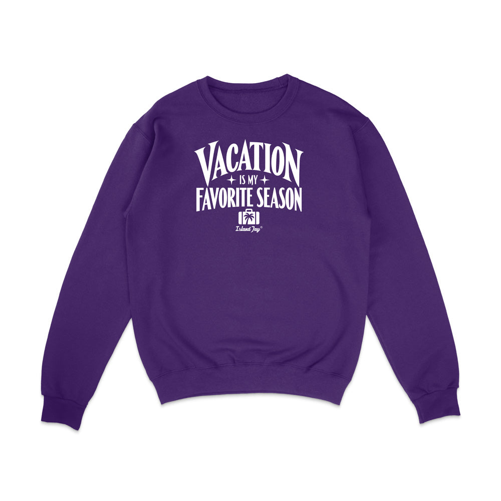 A purple crewneck sweatshirt with a white graphic text print reading 'VACATION IS MY FAVORITE SEASON' and a small 'Krazy Style' logo underneath, displayed on a clean white background.