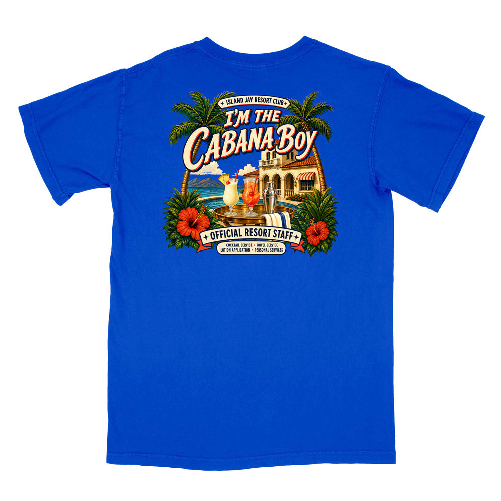 A royal blue short-sleeve t-shirt shown flat against a white background, featuring a large, colorful retro-style graphic on the back with palm trees, hibiscus flowers, a beach scene, and the text 'I'M THE CABANA BOY' and 'OFFICIAL RESORT STAFF'.