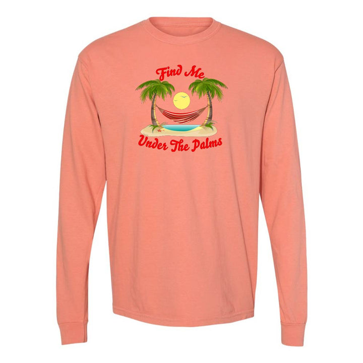 Light orange Longsleeve T-Shirt with beach, hammock, and palm trees graphic and text reading "Find Me Under The Palms".
