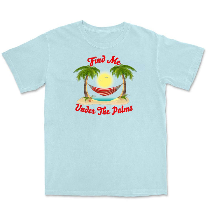 Light blue t-shirt with a tropical graphic and text 'Find Me Under The Palms' on a white background